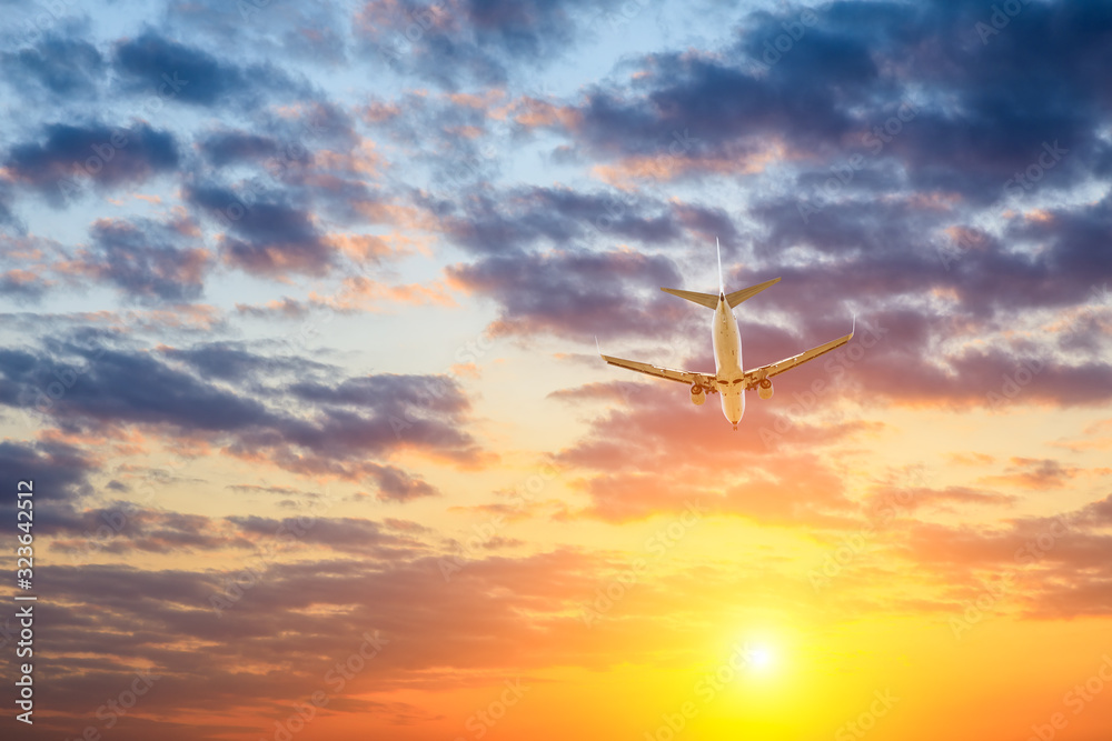 High-altitude airplane and beautiful sky at dusk High-altitude airplane and beautiful sky at dusk