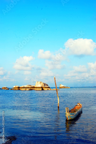 small boat on the quiet beach