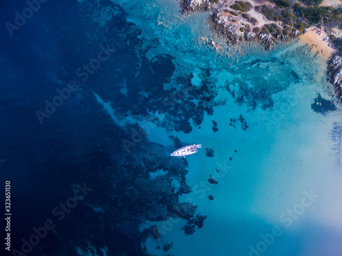 Scenic Sardinia island landscape. Italy sea ​​coast with azure clear water. Nature background from above - aerial image