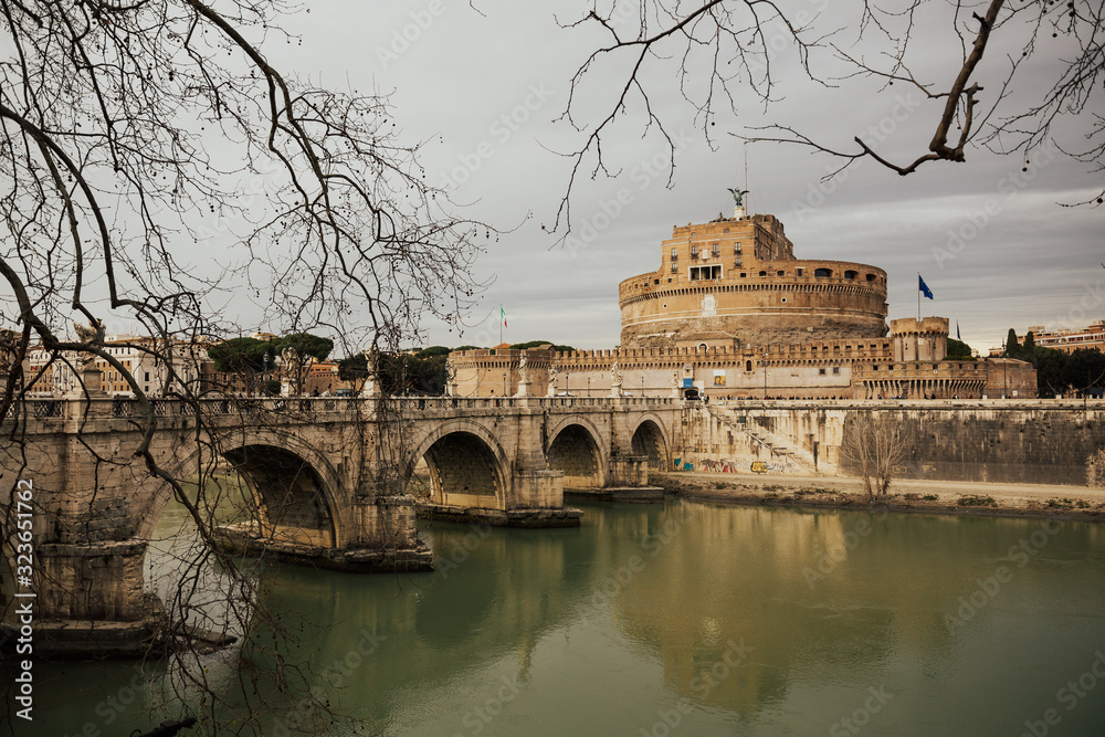 View of Tiber River, Castle of the Holy Angel usually known as Mausoleum of Hadrian and Aelian Bridge built in ancient Rome, Italy. It is now the famous tourist attraction of Italy. 