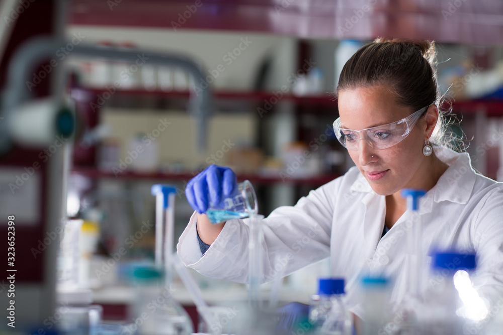 Female researcher carrying out scientific research in a lab (shallow DOF; color toned image) Female researcher carrying out scientific research in a lab (shallow DOF; color toned image)