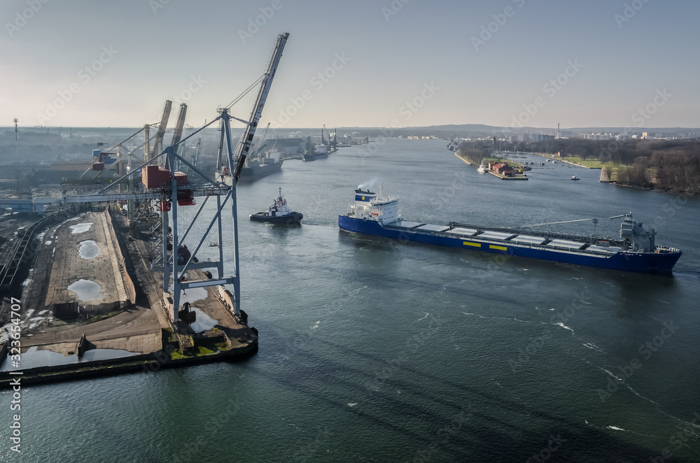 MARITIME TRANSPORT - The freighter maneuvers for mooring at seaport ...