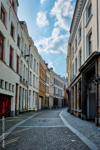 Antwerp street with row of houses at the old European city port, Belgium © Dmitry Rukhlenko