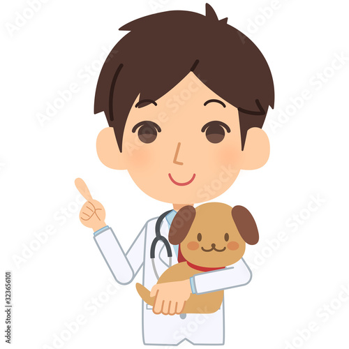 説明をする獣医と犬