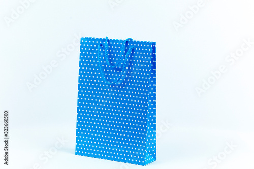 colorful shopping bags in front of a white backdrop