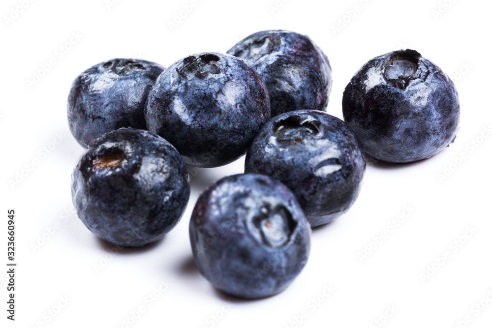 a handful of blueberries close-up isolated on white background a handful of blueberries close-up isolated on white background