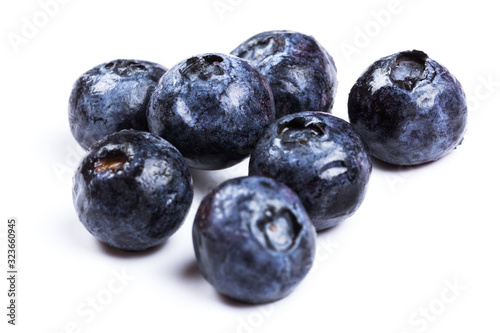 a handful of blueberries close-up isolated on white background