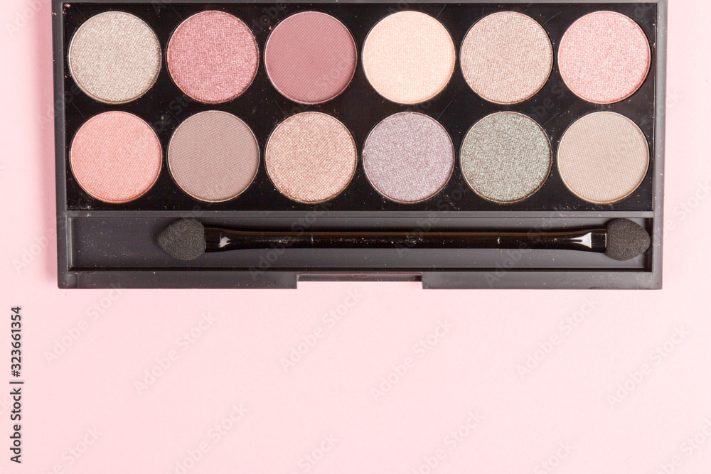set of pastel eyeshadows isolated on rose background set of pastel eyeshadows isolated on rose background