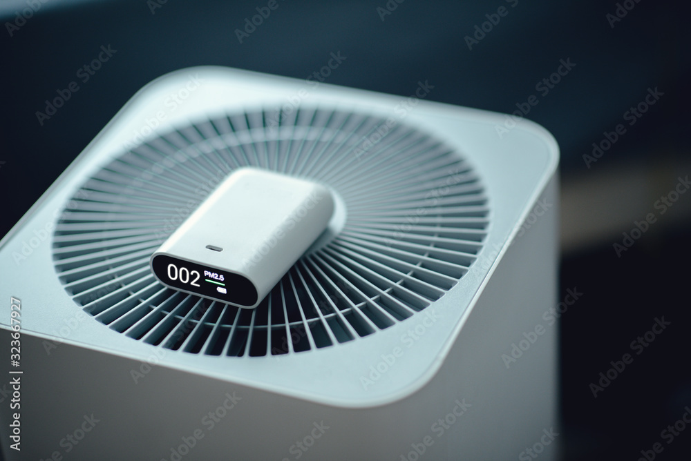 PM2.5 measuring indoor air quality and air purifier effectiveness. Dust free area for health