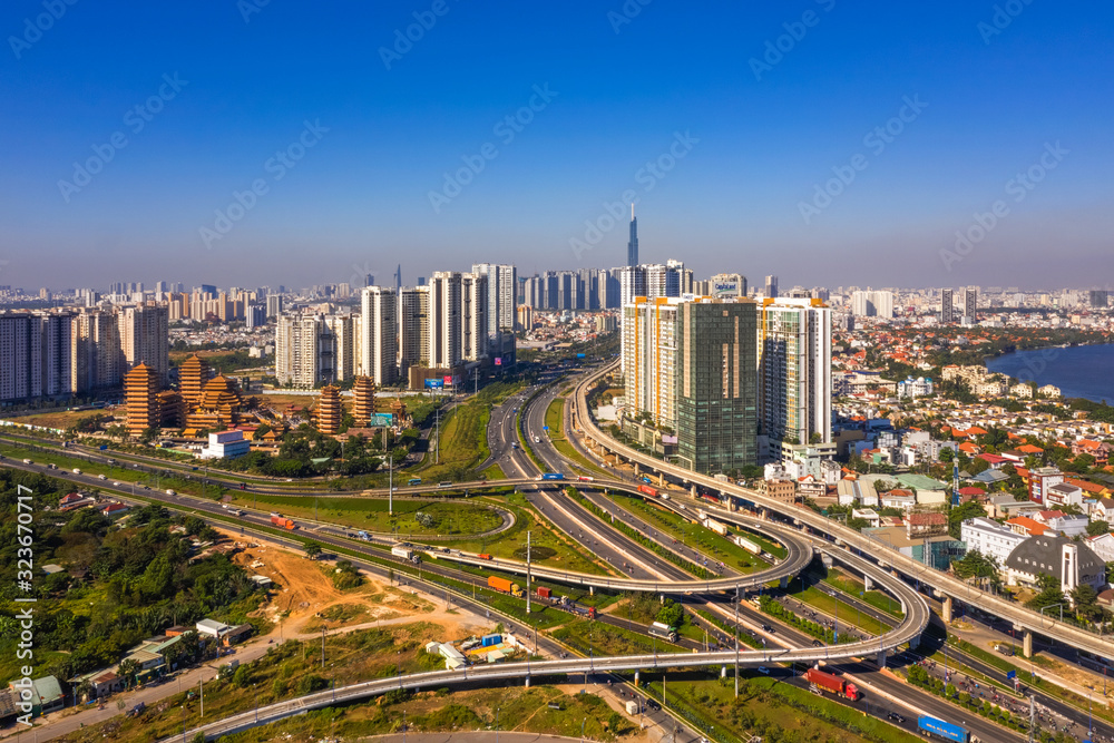 HO CHI MINH, VIETNAM - FEB 25, 2019: Top view aerial of Ha Noi highway and Cat Lai crossroads, Ho Chi Minh City with development buildings, transportation, infrastructure, Vietnam. 
