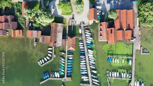 Aerial of boat houses at and jetties at lake Ammer, Bavaria, Germany photo