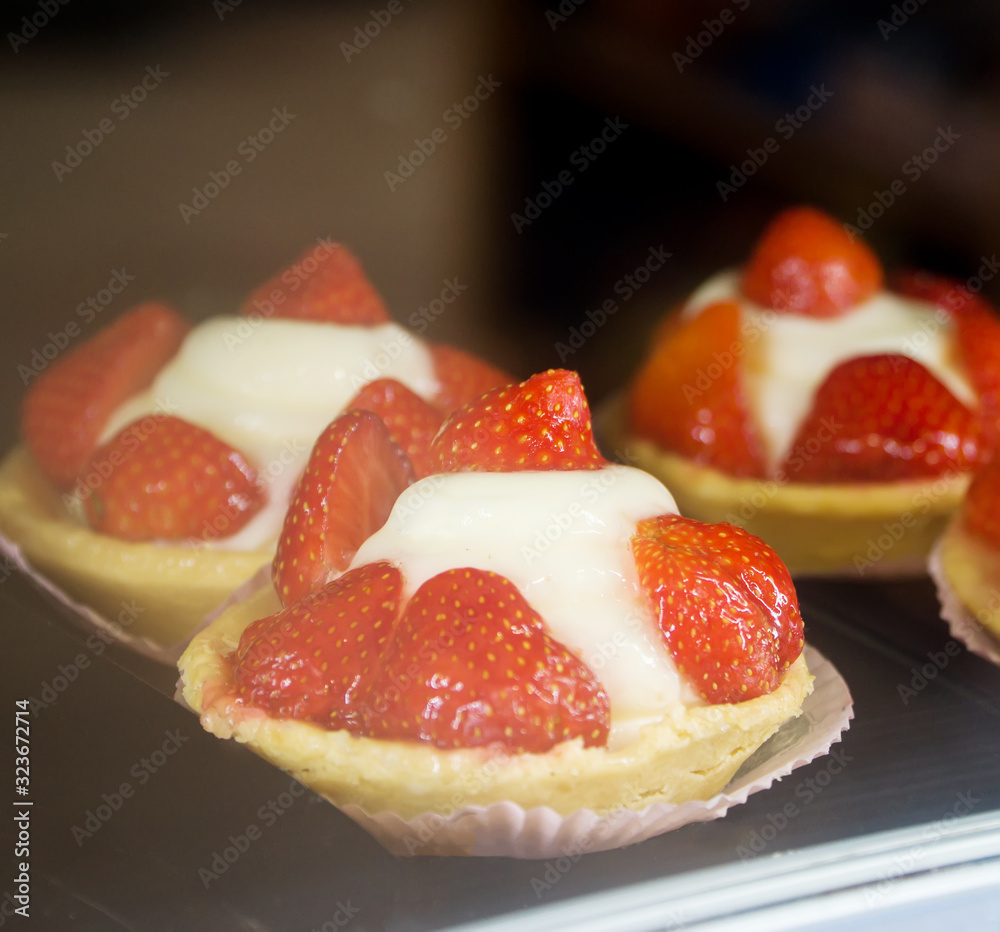 Close-up view of Custard baskets with strawberries.
