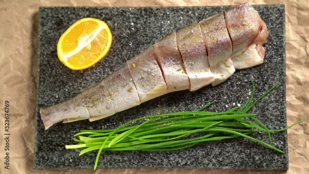 Cooking. Fish, onions on Board. sprinkle with salt Cooking. Fish, onions on Board. sprinkle with salt