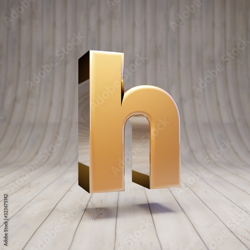 Golden letter H lowercase on wooden floor.