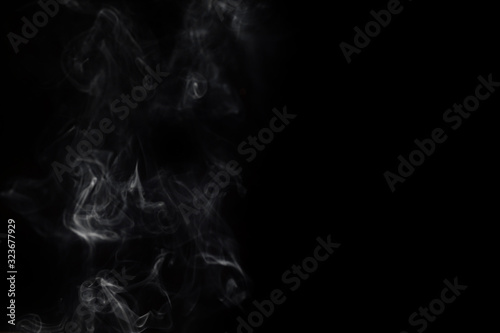 Abstract smoke image on black background © Natnawin