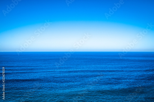 Sea Blue Seascape With Clear Horizon Line And Sky
