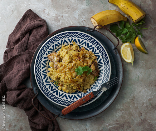 Mofongo, mashed  boiled plantains with porc meat, onion. Puerto Rico.  Amazonian cuisine, Peru, Cuba, Fufu de platano, tacaho photo