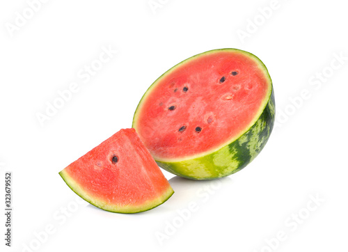 sliced and half cut ripe watermelon with seeds on white background