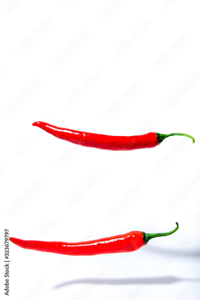 red chili peppers on a white background red chili peppers on a white background