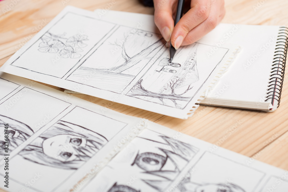 Premium Photo  Artist drawing an anime comic book in a studio