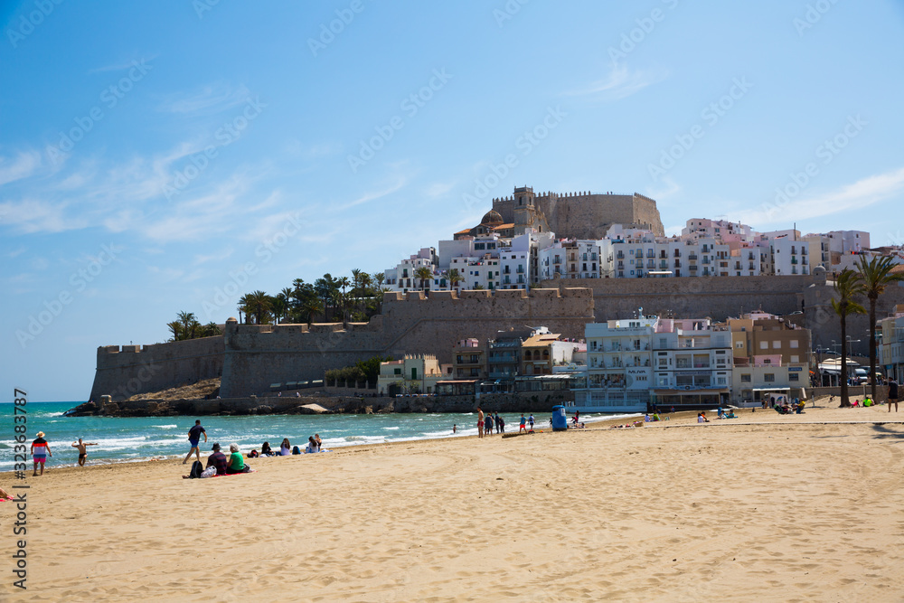 View of Peniscola buildings with beachside at sunny day, Spain