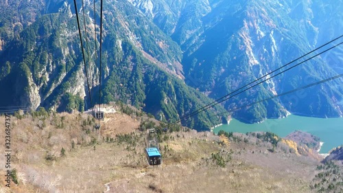 A blue cable car going down the mountain in Japan