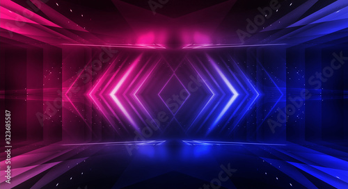 Background of empty stage show. Neon blue and purple light and laser show. Laser futuristic shapes on a dark background. Abstract dark background with neon glow