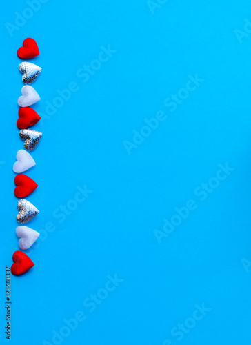 Small hearts on a light blu...