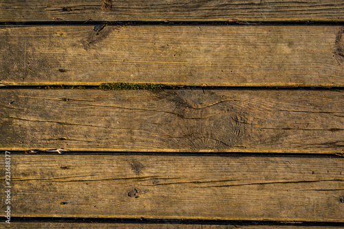 Wooden surface floor as texture grungy scratchy wood close up as retro vintage background toned in warm colors