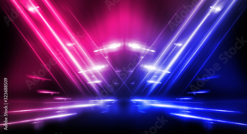 Background of empty stage show. Neon blue and purple light and laser show. Laser futuristic shapes on a dark background. Abstract dark background with neon glow