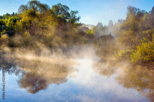 spring landscape with fog and river at sunrise