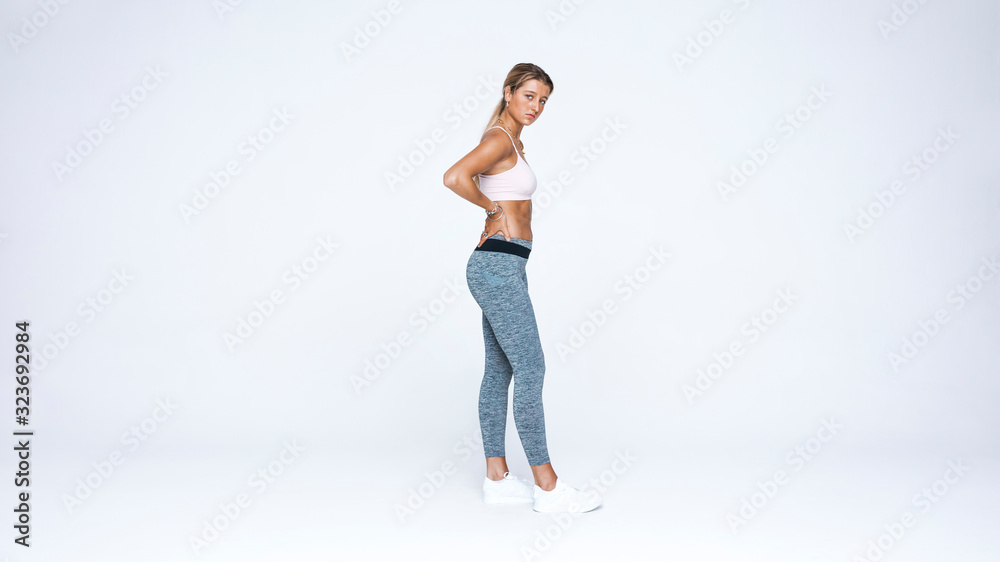 Woman standing in workout clothes Woman standing in workout clothes