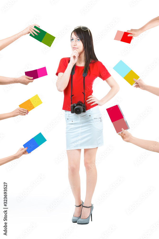 Difficult choice. It is a lot of different offers. Many hands holding the colorful offers. A beautiful young woman in a red blouse and white skirt, thinking about choosing a photoschool, isolated. Difficult choice. It is a lot of different offers. Many hands holding the colorful offers. A beautiful young woman in a red blouse and white skirt, thinking about choosing a photoschool, isolated.