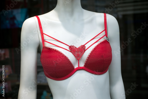 closeup of red bra on mannequin in fashion store showroom for women