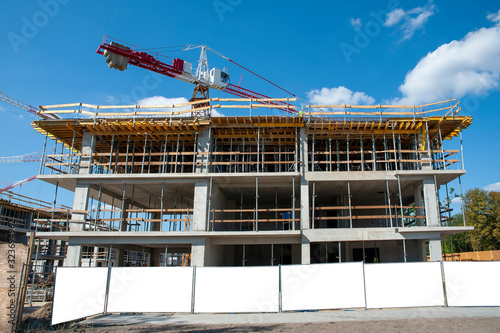 Blank white banner for advertisement on a fence of a building under construction photo