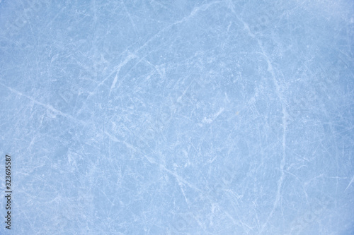 Photography texture of ice on the rink with skating traces