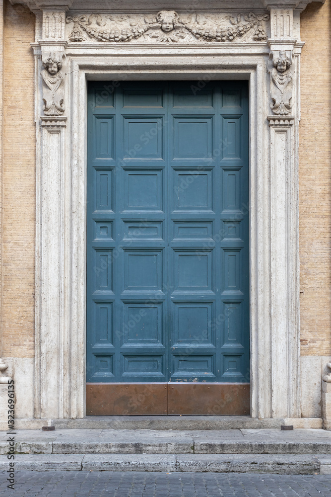 ancient green wooden arched door, Italy Europe