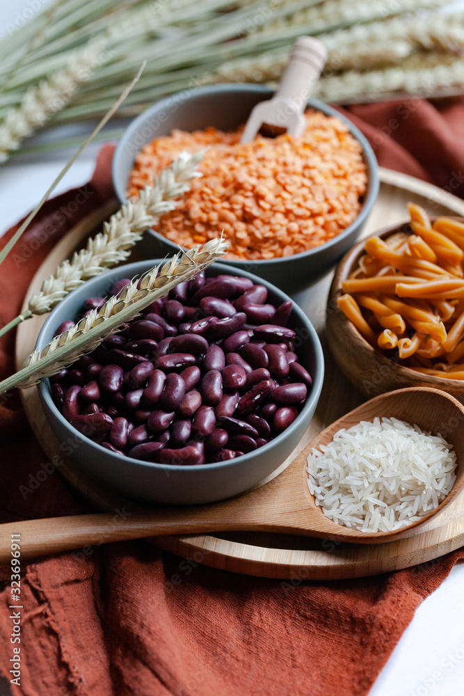 Vegan protein source. Beans, lentils, chickpea pasta. Healthy and tasty vegetarian food, ingredients ready for cooking. Front view, close up. Vegan protein source. Beans, lentils, chickpea pasta. Healthy and tasty vegetarian food, ingredients ready for cooking. Front view, close up.