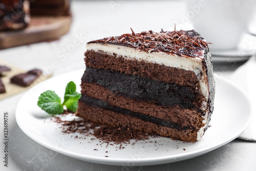Tasty chocolate cake served on table, closeup