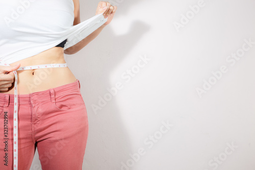 Healthcare and woman diet lifestyle concept to reduce belly and shape up healthy stomach muscle.