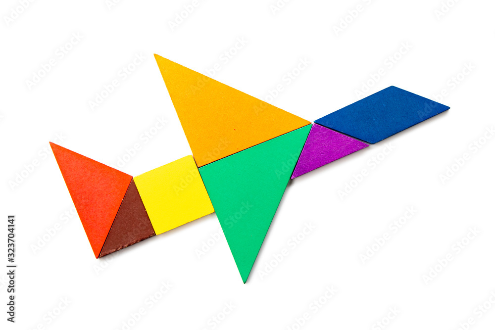 Color wood tangram puzzle in airplane shape on white background Color wood tangram puzzle in airplane shape on white background