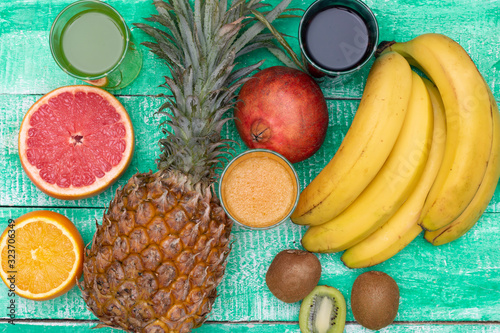 Variety of fruits and berries. Food fruits background. Flat lay photo