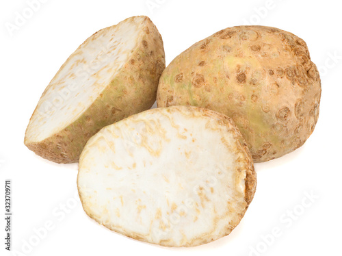 Celery root and its halfs isolated on a white background. Close-up.