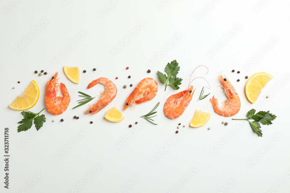 Flat lay with shrimps and spices on white background, top view Flat lay with shrimps and spices on white background, top view