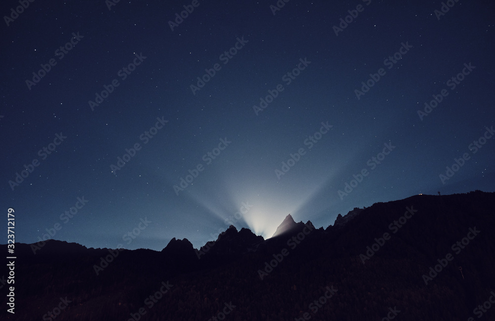 Moon light. Night mountain landscape. Alps, France.