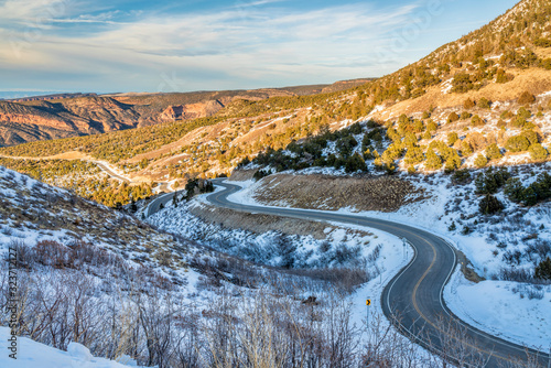 scenic windy mountain road in winter scenery
