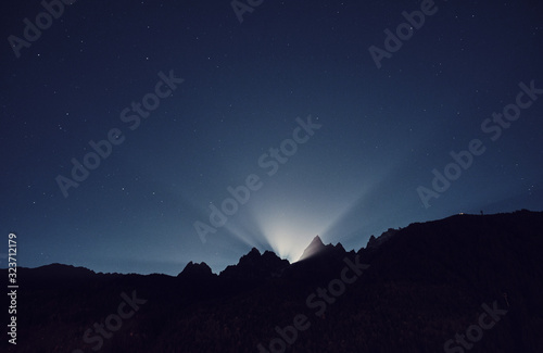 Moon light. Night mountain landscape. Alps, France.