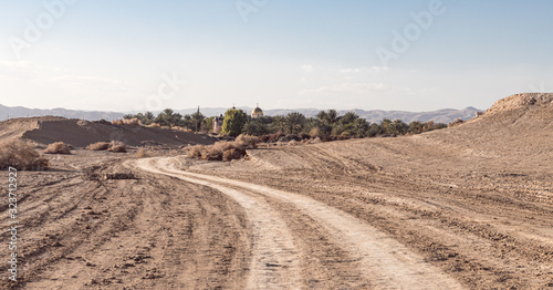 View from the Judean Desert to the monastery of Gerasim Jordanian - Deir Hijleh - in the Judean desert near the city of Jericho in Israel