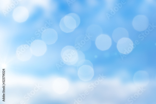 Abstract background of blue sky with bokeh and sunlight