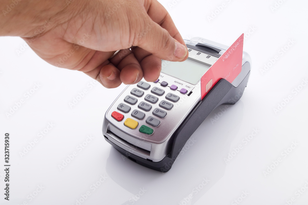 Credit card and pos terminal on white Credit card and pos terminal on white